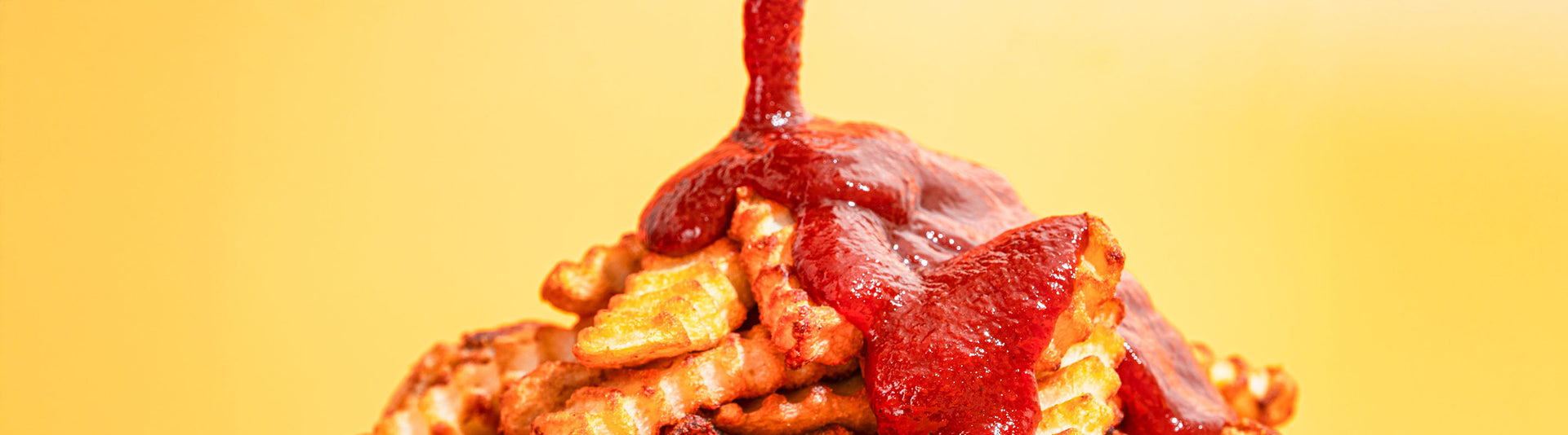 Fries with KetchHot being drizzled on them
